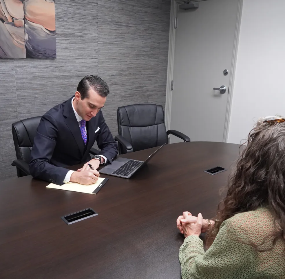 Attorney Jed Strong meeting with a client during a free case evaluation.