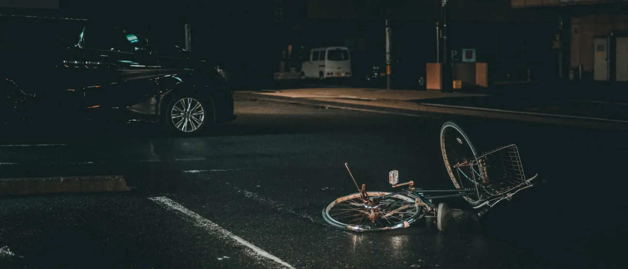 Bicycle on the road after an accident representing evidence review in an injury claim.