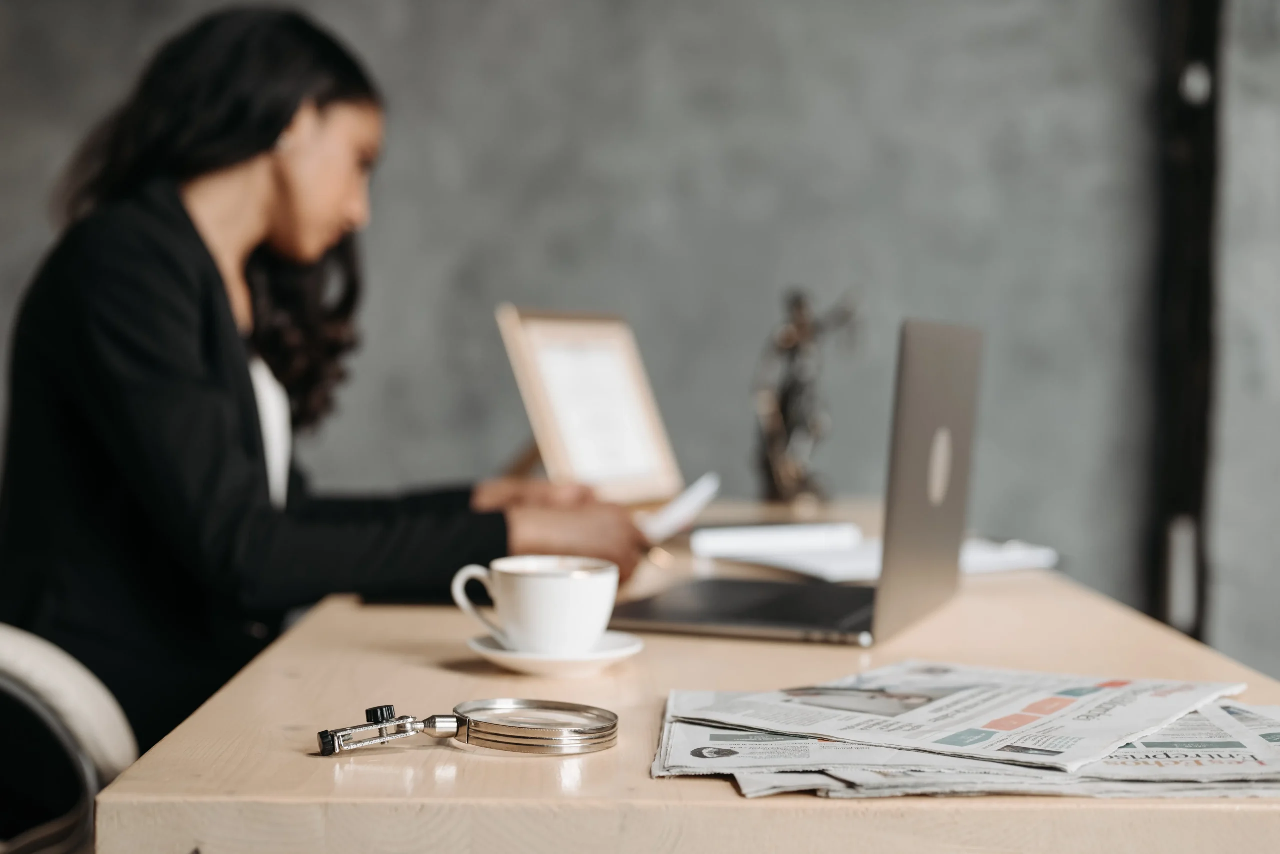 Legal professional reviewing injury claim documents for a Strong Law client.