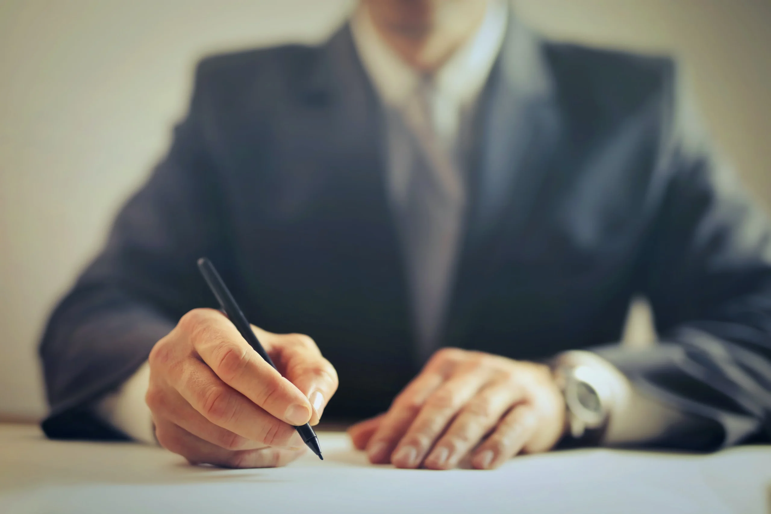 Legal professional writing notes during a free injury case evaluation.