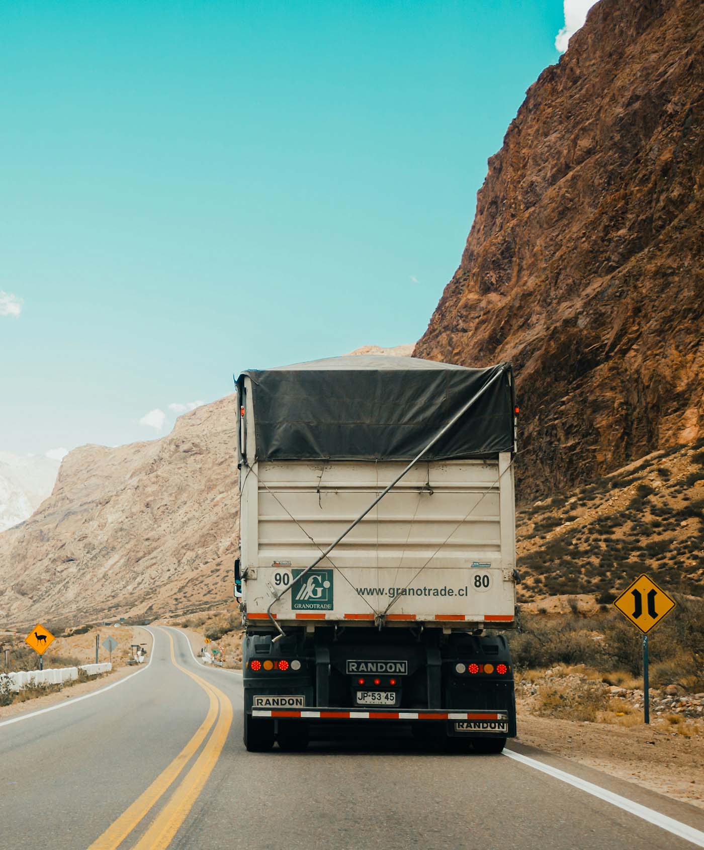 Back of a large truck driving through a mountain road near Eugene, Oregon