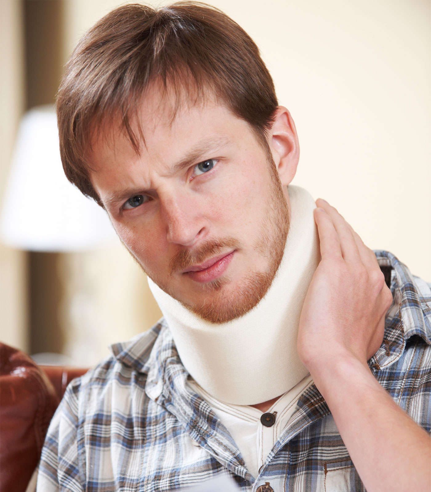 Man with neck brace suffering from whiplash after a personal injury accident in Tacoma