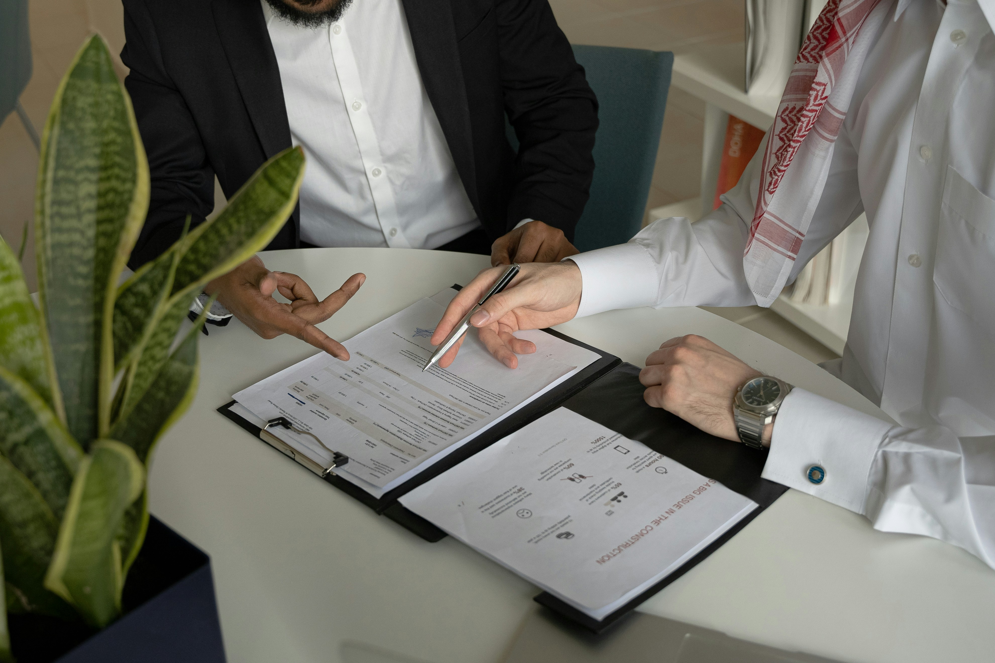 Two people reviewing legal documents during a truck accident lawyer consultation
