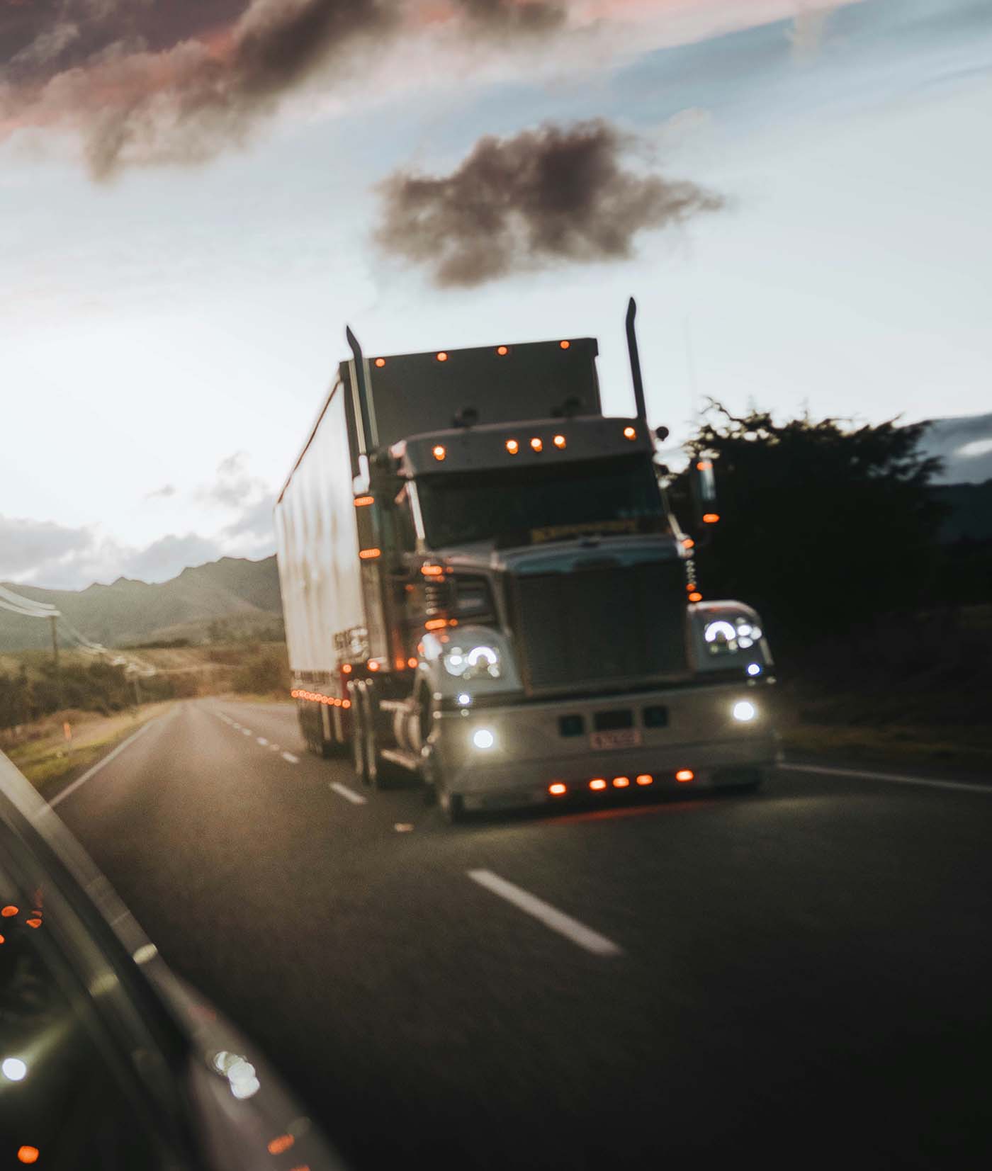Semi-truck driving on a highway representing a Washington semi truck accident lawyer claim.